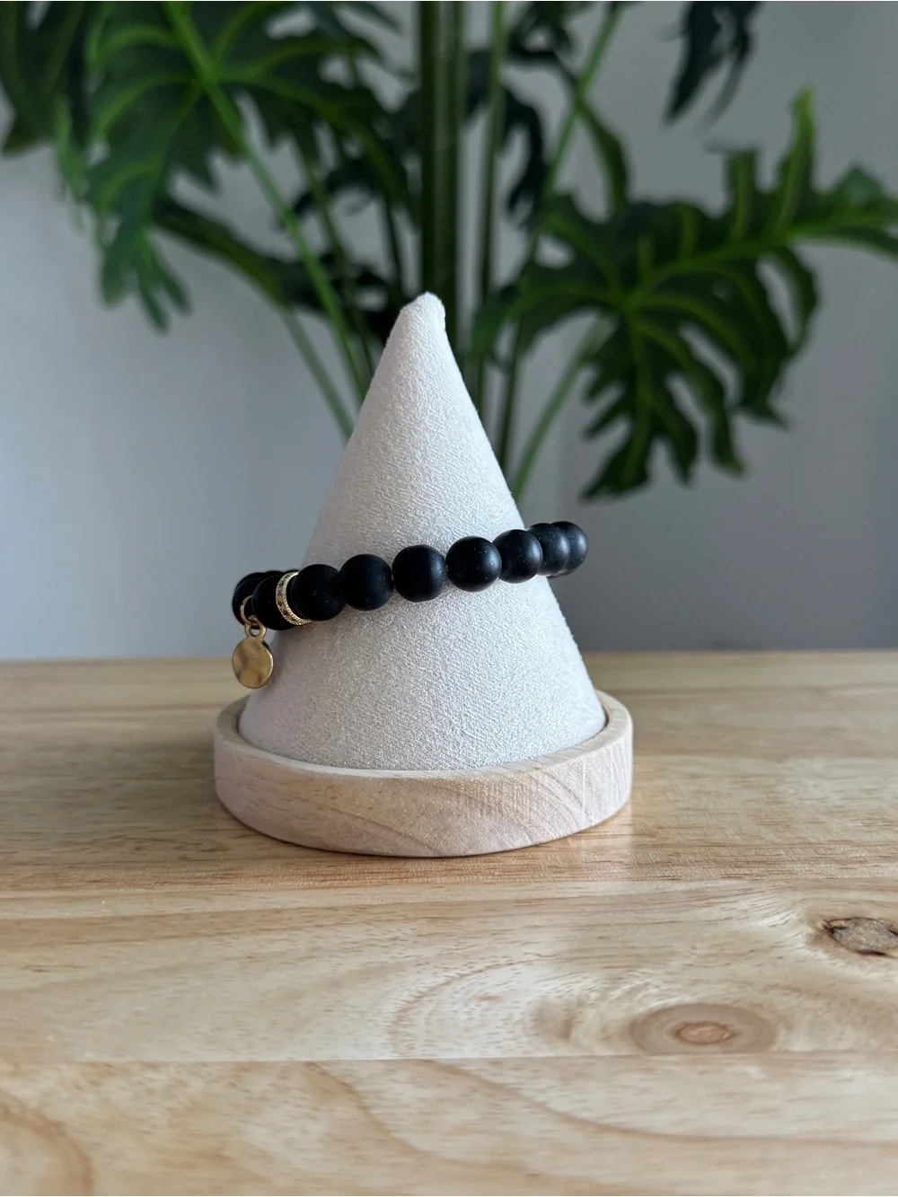 Matte Black Beaded Stretch Bracelet with Gold Charm